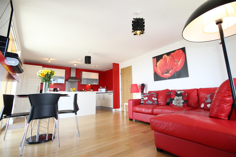 The bright open plan kitchen and living area of the two bedroom superior apartment