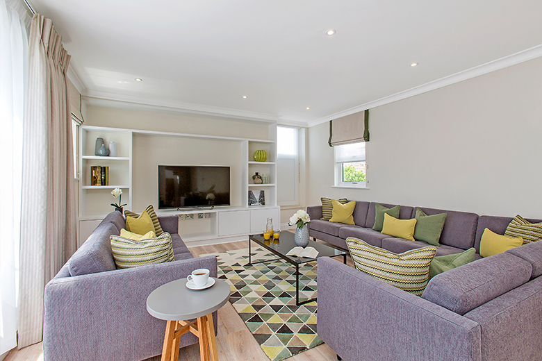 A relaxing and colourful living room in a three bedroom penthouse