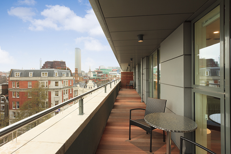 A spacious and bright terrace balcony at St Martins Apartments