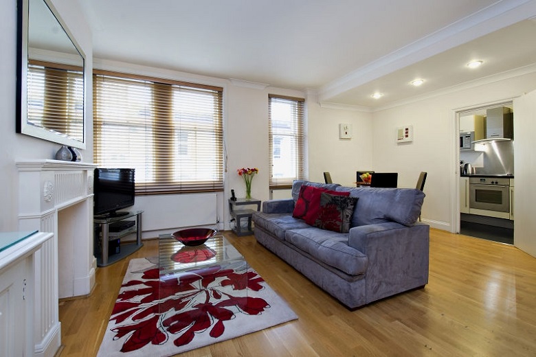 A comfortable, open plan living area with a large flat screen television