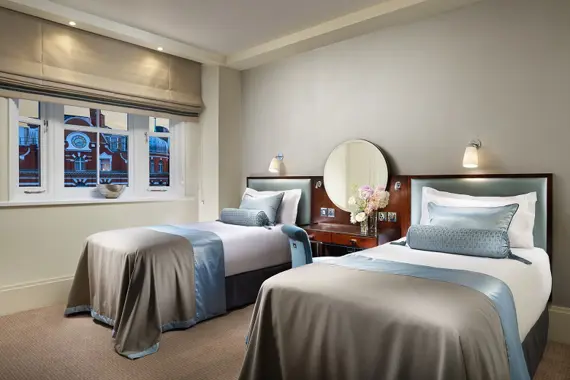 A spacious twin bedroom in a Kings Three Bedroom Suite
