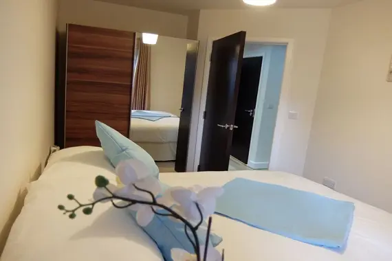 Another comfortable bedroom with good storage space