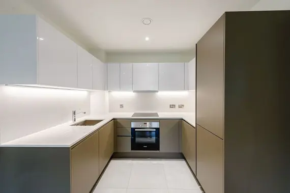 A stunning, sleek kitchen fully equipped with modern appliances