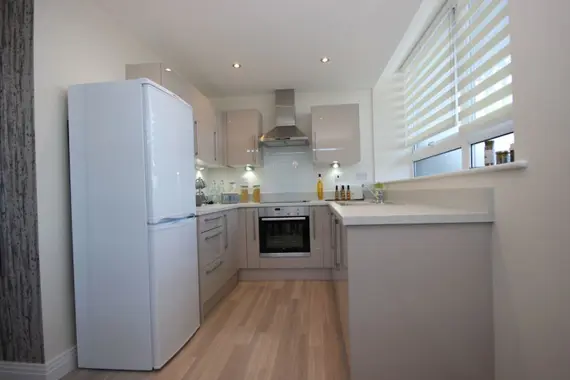 A bright and well equipped kitchen.