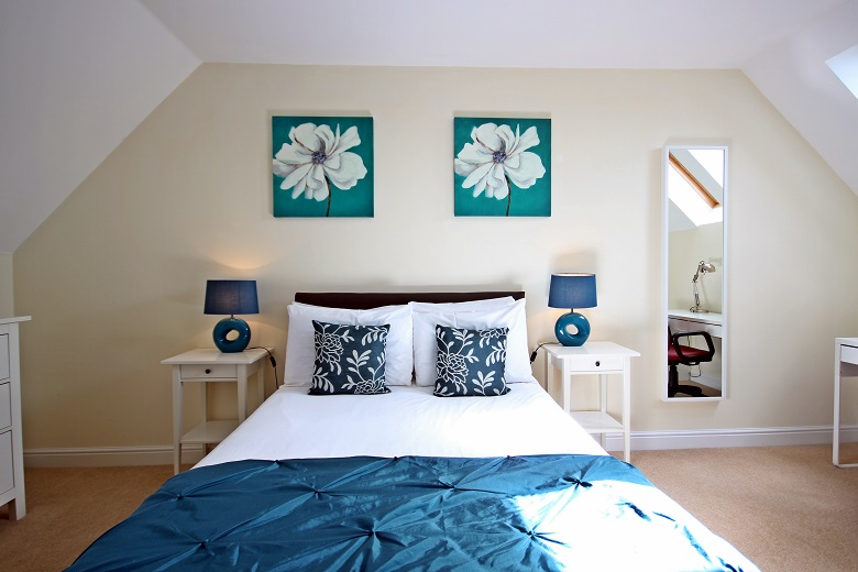 Bright double bedroom with a desk area