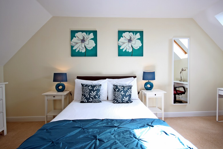 Bright double bedroom with a desk area