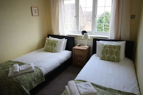 A twin bedroom at The Poppies