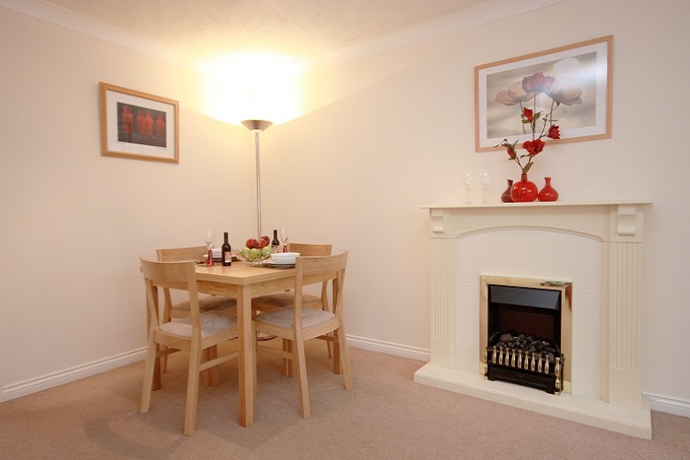 Dining area with a feature fireplace