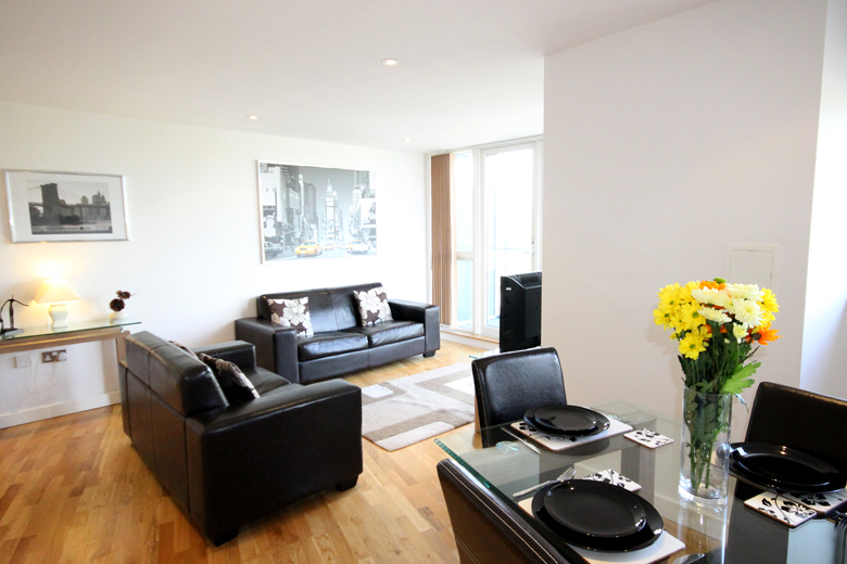 The spacious lounge area of a one bedroom apartment