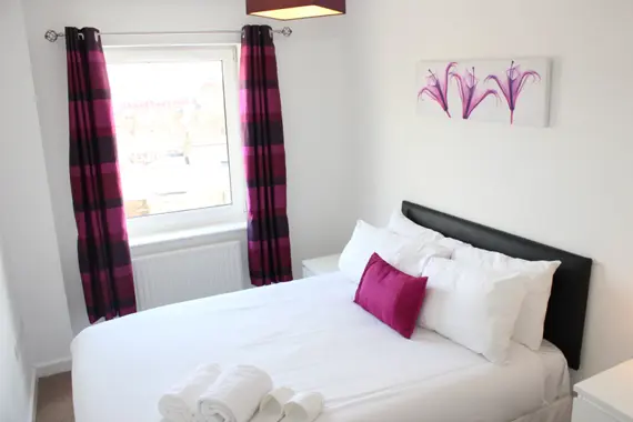 A bright, comfortable bedroom at The Pinnacle