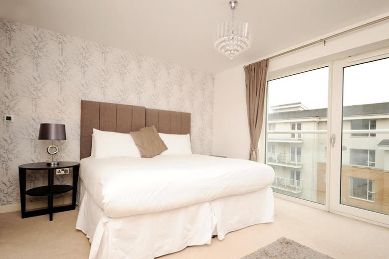 A elegant and stylish Gold bedroom standard apartment