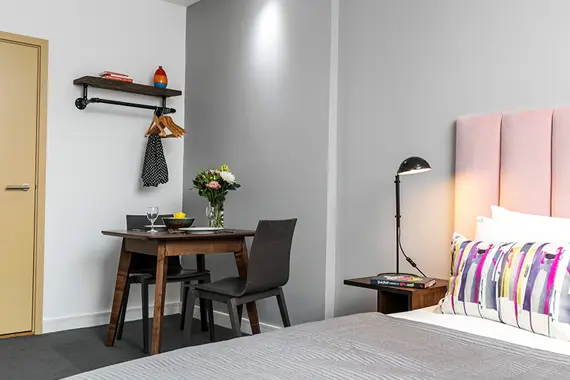 A work desk in a standard studio apartment