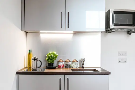 A compact kitchen in a standard studio