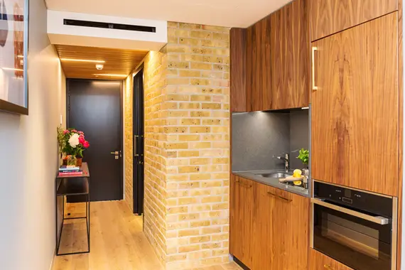 Beautiful exposed brick wall in this studio apartment