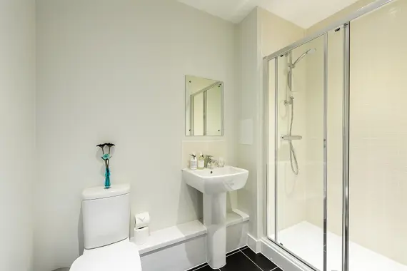 A shower room in a two bedroom apartment