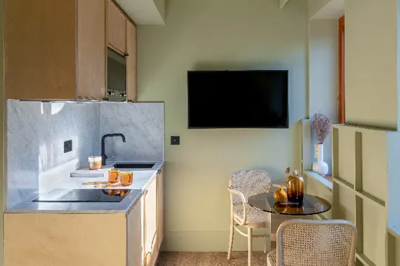 Stylish kitchen and dining table in the city studios