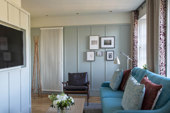 A deluxe one bedroom apartment with bright furniture