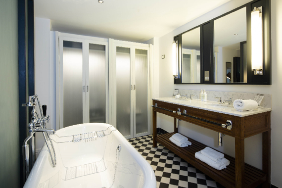 A spacious monochrome tiled bathroom