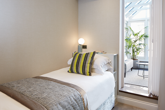 A single bed in one of the three bedroom townhouses