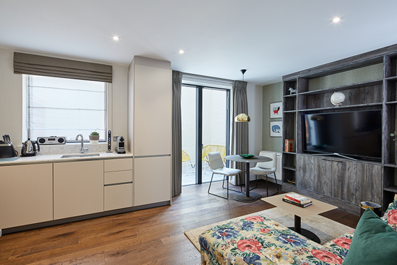 A floral relaxing lounge area in one of the one bedroom apartments