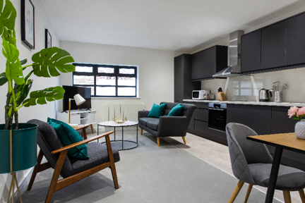 A spacious and bright fully equipped kitchen and lounge area