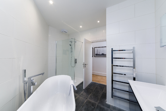 Relax in this lovely standing bath and shower room
