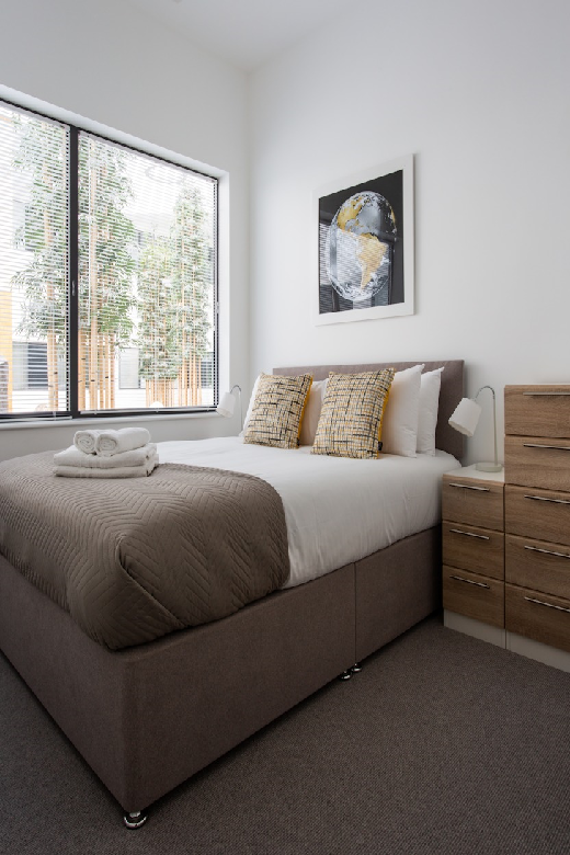 A lovely and bright bedroom with a view