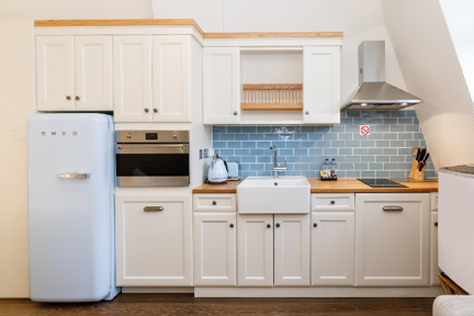 A wooden fully equipped kitchen