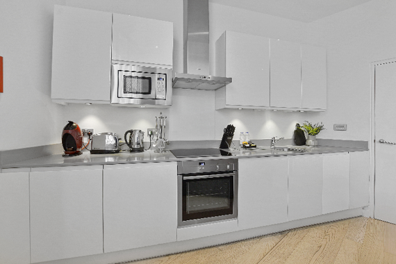 A fully equipped kitchen in the one bedroom apartments