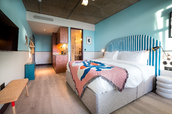 A spacious and bright bedroom and living area