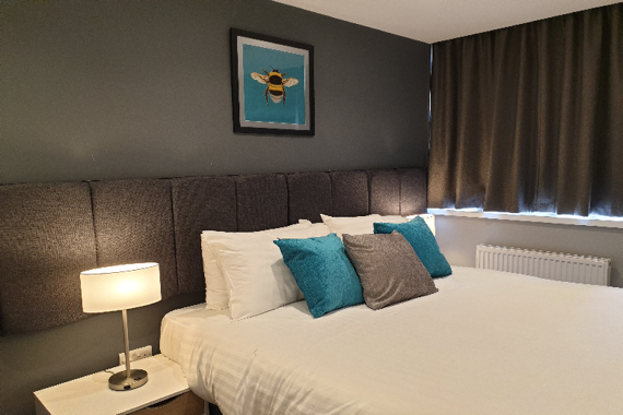 A comfortable and relaxing bedroom in The Spires Cardiff