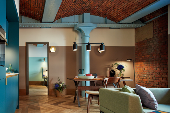 Open plan livingroom, kitchen and dining area in a two bedroom apt