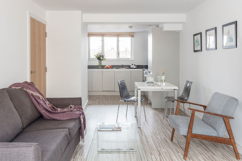 An open plan kitchen and lounge area