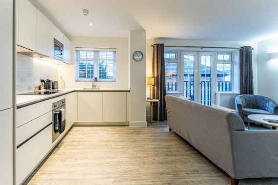 A beautifully furnished open plan living and kitchen area