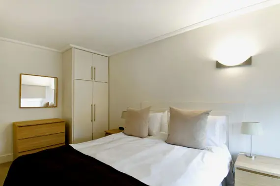 A bright and comfortable bedroom with good storage space