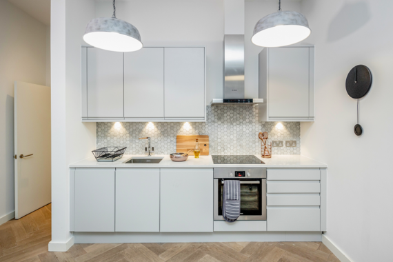 A fully equipped kitchen in the two bedroom apartments