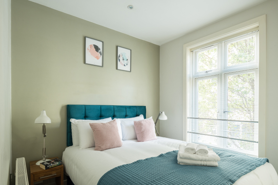 A bright and comfortable bedroom space in Fitzrovia