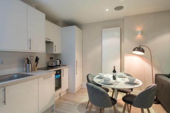 A fully equipped kitchen in the two bedroom apartments
