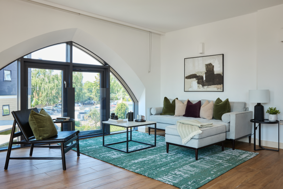 Immerse yourself in a rather spacious and decorative living room, adorned with tasteful accents and eye-catching details