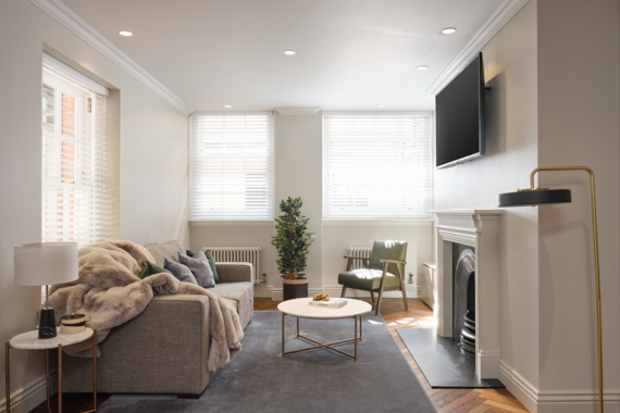 Cozy and warm living room, featuring a fireplace and cozy furnishings for a homely feel
