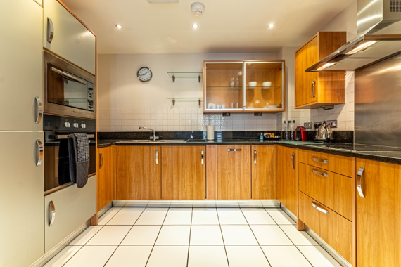 A fully-equipped kitchen in Riverside House