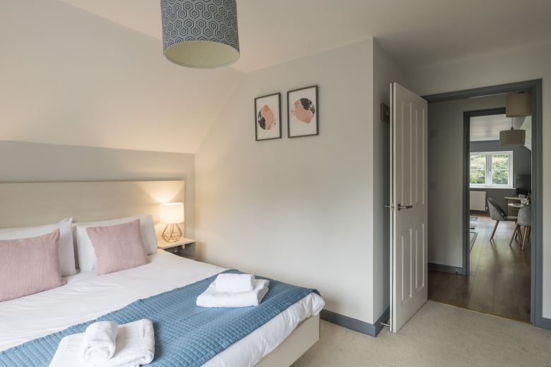 Relax in the spacious and comfortable double bedroom, offering a tranquil sanctuary for a restful night's sleep