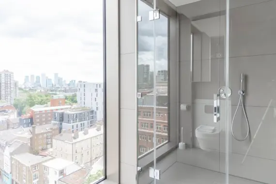 Pristine shower room for relaxation with a view