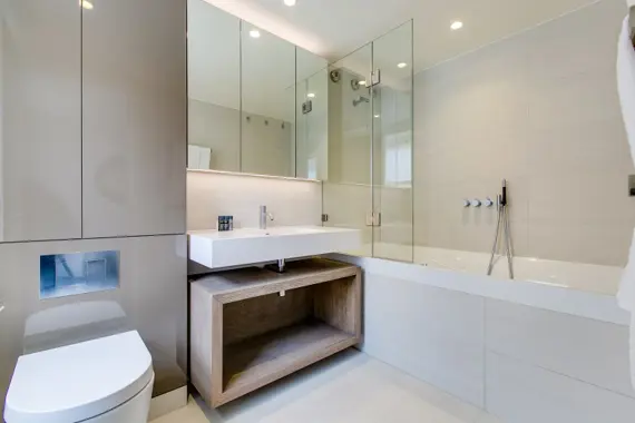 Step into a bright and modern bathroom featuring ample lighting