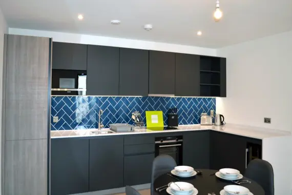 Embrace the modernity of a well-equipped kitchen, where sleek finishes and functional design come together seamlessly