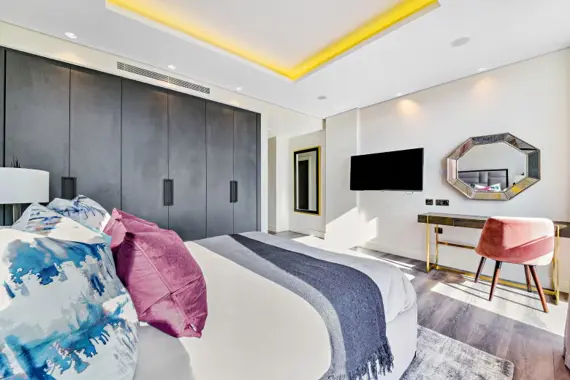 Inviting bedroom oasis with a cozy bed and serene ambiance