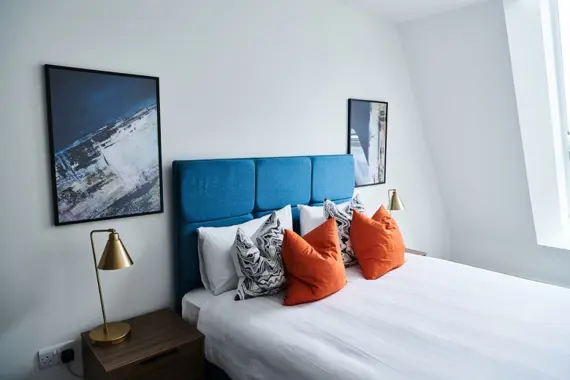 Inviting bedroom oasis with a cozy bed and serene ambiance