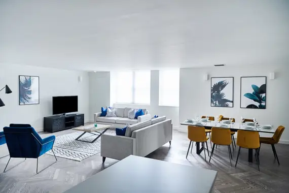 Modern living space bathed in natural light and stylish decor