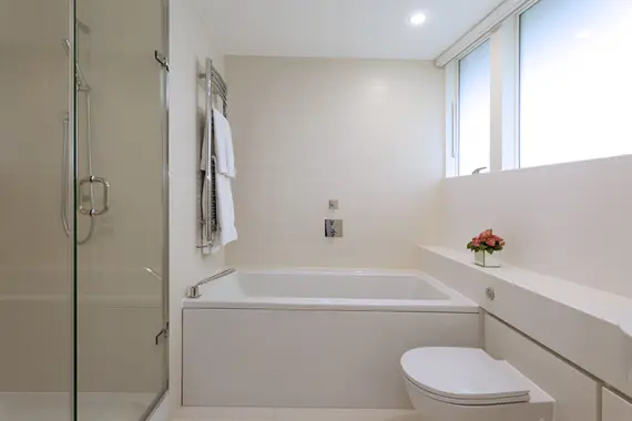 A bright, modern bathroom at St Martins Apartments