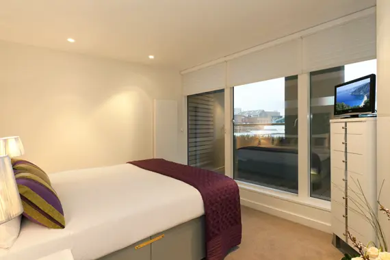 A comfortable and relaxing bedroom at St Martins Apartments
